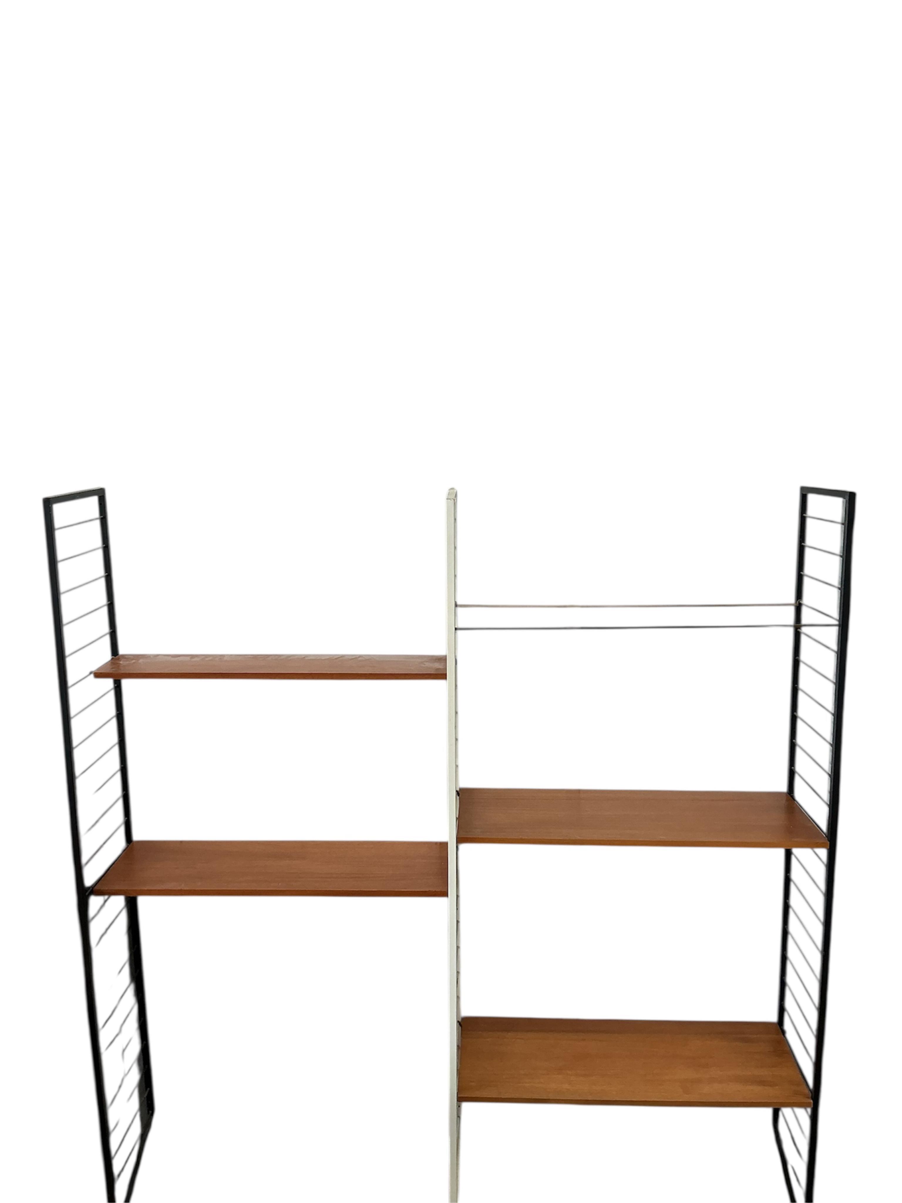 A mid century teak Ladderax type shelving unit, width 185cm, depth 36cm, height 200cm